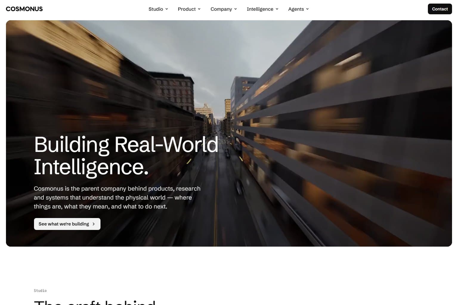 The Cosmonus home page: 'Building Real-World Intelligence.' over a city street in motion.